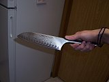 Our super sexy Calphalon 7" Santoku knife. Very sharp. 